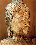 Close-up of the head of a statue of the Buddha covered in gold leaf, Wat Pho (Wat Po) (Wat Chetuphon), Bangkok, Thailand, Southeast Asia, Asia