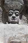 Buddha image carved into cliff side, Yushu, Qinghai, China, Asia