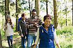 Friends hiking in woods