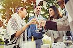 Friends toasting champagne glasses at birthday party