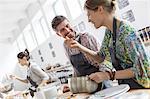 Couple enjoying cooking class kitchen