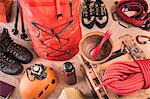 Overhead view of prepared climbing equipment with rucksack, climbing boots and climbing rope