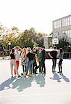 Teenagers standing on schoolyard