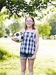 Girl posing with football