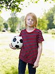Boy posing with football