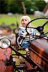 Portrait of baby boy on tractor