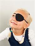 Portrait of girl wearing eye patch at health control