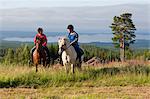 Mature women horse riding