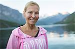 Portrait of smiling woman at lake