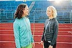 Smiling women on running track