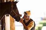 Man tending to his horse