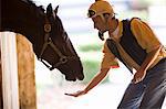 Man feeding his horse