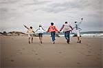 Family having fun at beach.