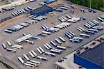 Rows of buses in parking lot