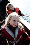 Portrait of children in a boat, Sweden.