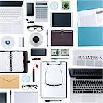 Business desktop stationery, laptops, mobile phone and devices composing a business background, top view