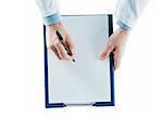 Doctor writing a prescription on a clipboard on white background, top view, hands close up