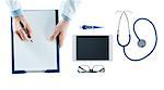 Doctor at desk writing a prescription on a clipboard on white background, top view