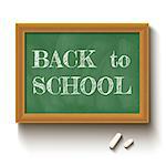 Vector illustration of a chalkboard and chalks with text back to school