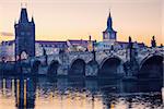 Prague city sunrise over Charles Bridge on Vltava river, Czech Republic