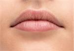 Beautiful young woman's full lips close-up, perfect skincare concept
