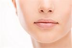 Beautiful young woman's full lips close-up, perfect skincare concept