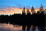 Romantic sunset on the river Pongoma. North Karelia, Russia