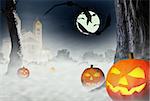 The night of Halloween. Bats and Halloween pumpkins on the background of the gloomy house and the forest in the fog