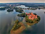 Trakai, Lithuania: aerial UAV top view of Island Castle in the sunrise. Historical residence in capital city of Grand Duchy of Lithuania, located in Galve lake