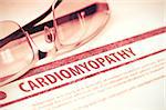 Cardiomyopathy - Medical Concept with Blurred Text and Specs on Red Background. Selective Focus. 3D Rendering.