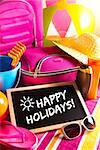 Happy summer holidays card with bright text on blackboard.