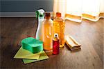 Wood floor cleaner products on parquet with sponges and microfiber cloth.