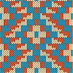 Abstract knitting ornamental seamless geometric vector pattern as a knitted fabric texture in blue, beige and orange colors