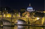 view of Ponte Vittorio Emanuele II and St. Peter's Basilica in evening, Rome