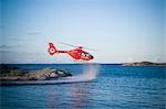 Medevac flying over lake