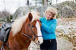 Senior woman with Icelandic horse