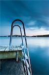 Swim ladder on jetty at dusk