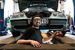 Smiling mechanic in auto repair shop