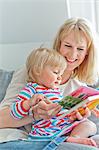 Mother with daughter reading book