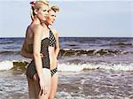 Two young retro women on beach