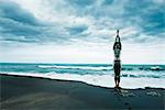 MI adult woman n wetsuit at beach