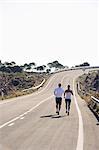 Couple running on road