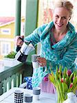 Woman preparing table, Djurgarden, Sweden