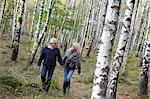 Senior couple walking in forest, Delsjon, Gothenburg, Sweden