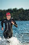 Woman in wetsuit in sea, Sweden