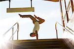 Man doing handstand, New York City, USA