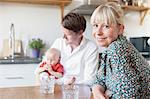 Parents with baby in kitchen