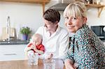 Parents with baby in kitchen