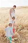 Mother with daughters in meadow