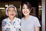 Two women at a noodle shop, a small unit with a fast food kitchen and unit producing Soba noodles